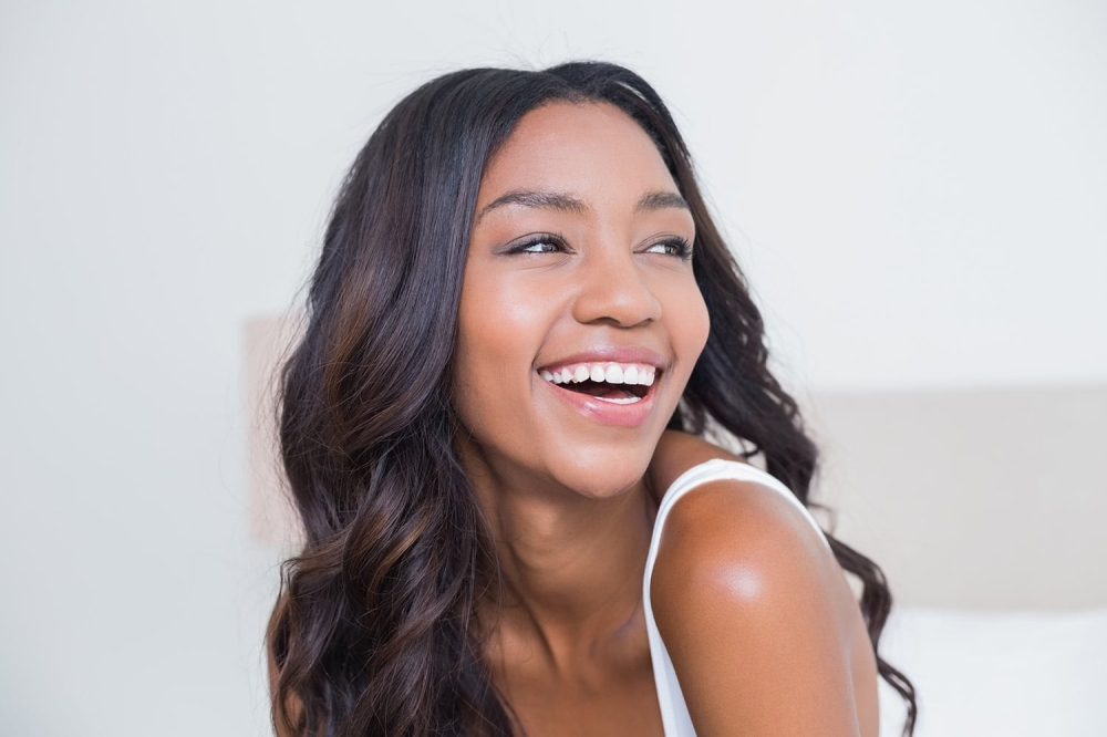 Woman smiling at dentist in Austin
