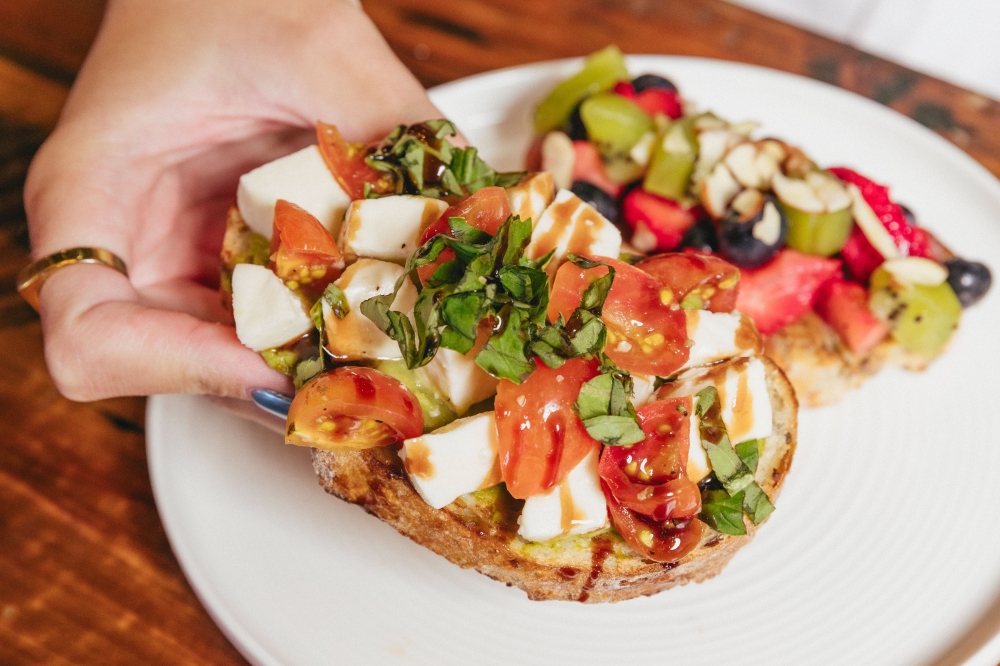 The menu features specialty toasts such as the Cheesy Caprese. (Courtesy Grain & Berry)