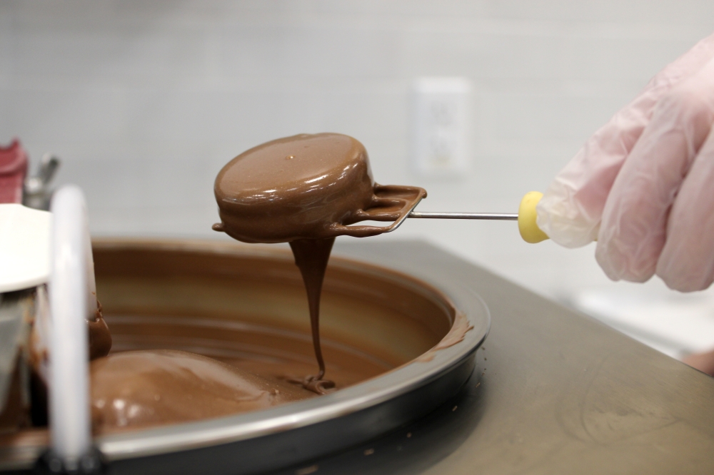 A Chocolate-dipped Oreo ($1.99) is hand-dipped in-store by Kilwins employees. (Anna Maness/Community Impact)