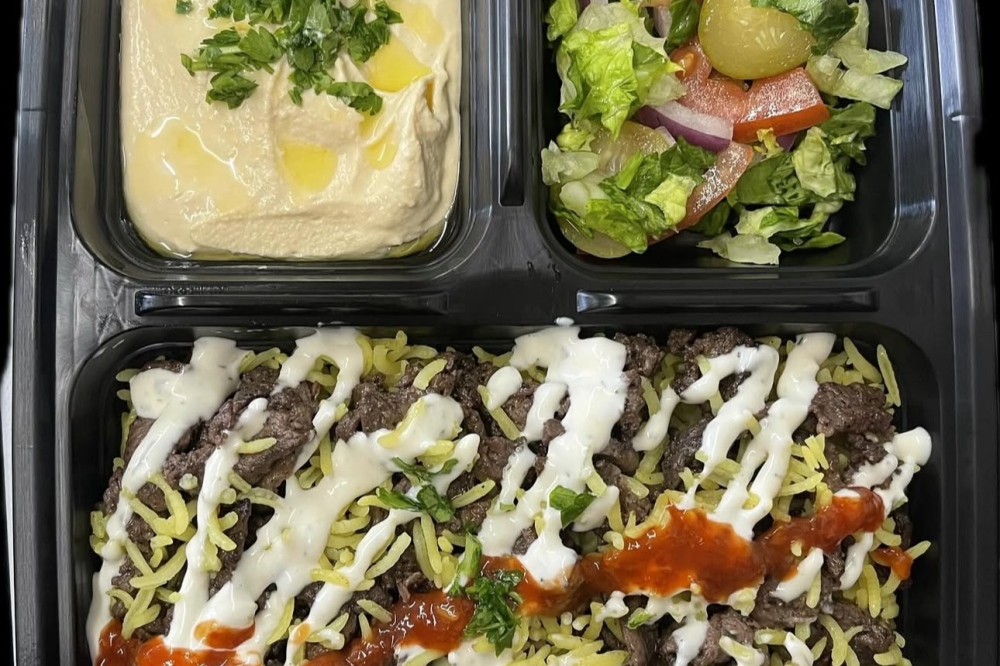 The food truck serves Mediterranean dishes such as beef shawarma over rice and hummus. (Courtesy Halal Joy)