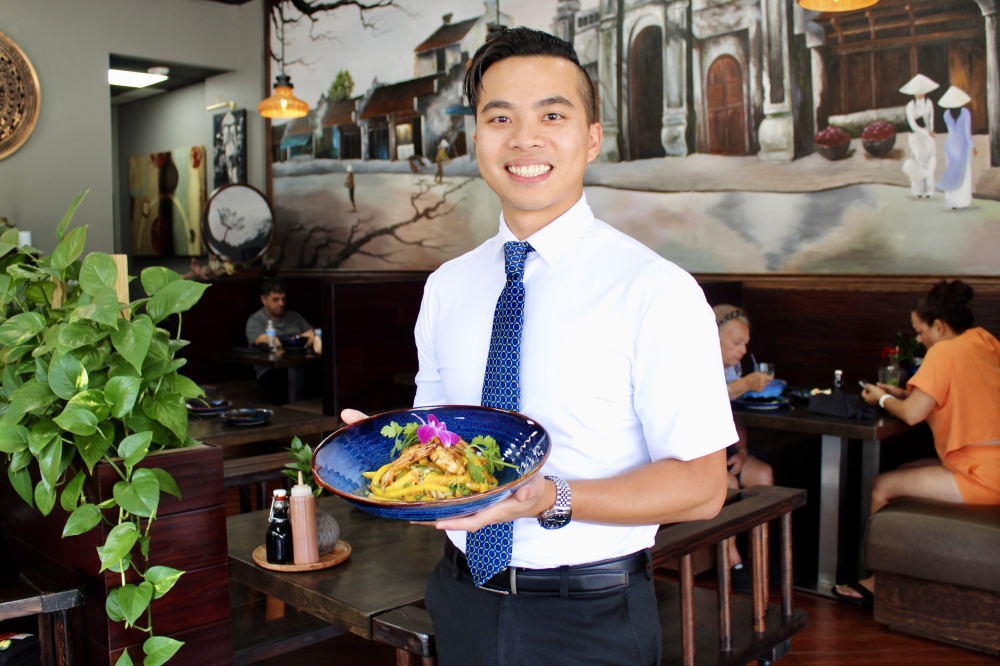 Le Emperor owner Jason Hoang operates the hospitality side of his business and creates the restaurants dishes. (Jovanna Aguilar/Community Impact)