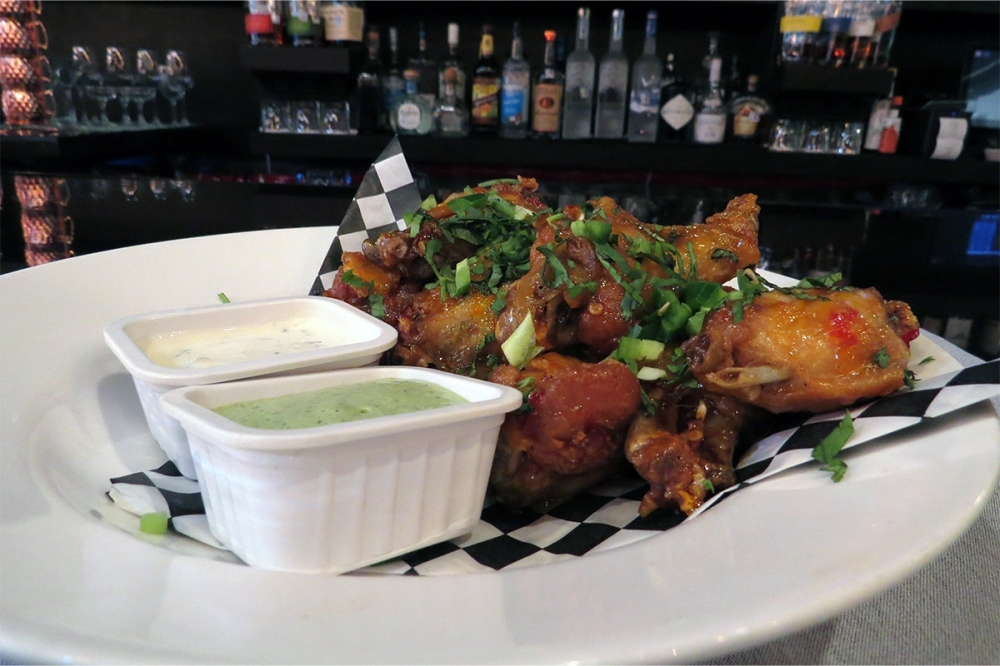 Wings with Thai chili butter. (Kevin Vu/Community Impact)