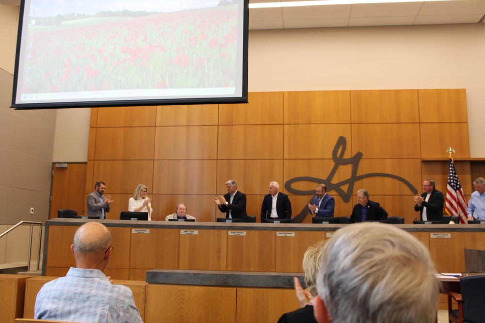 After giving his final comments as District 3's representative, outgoing council member Mike Triggs received a standing ovation from elected officials and staff on the dais. (Anna Maness/Community Impact)