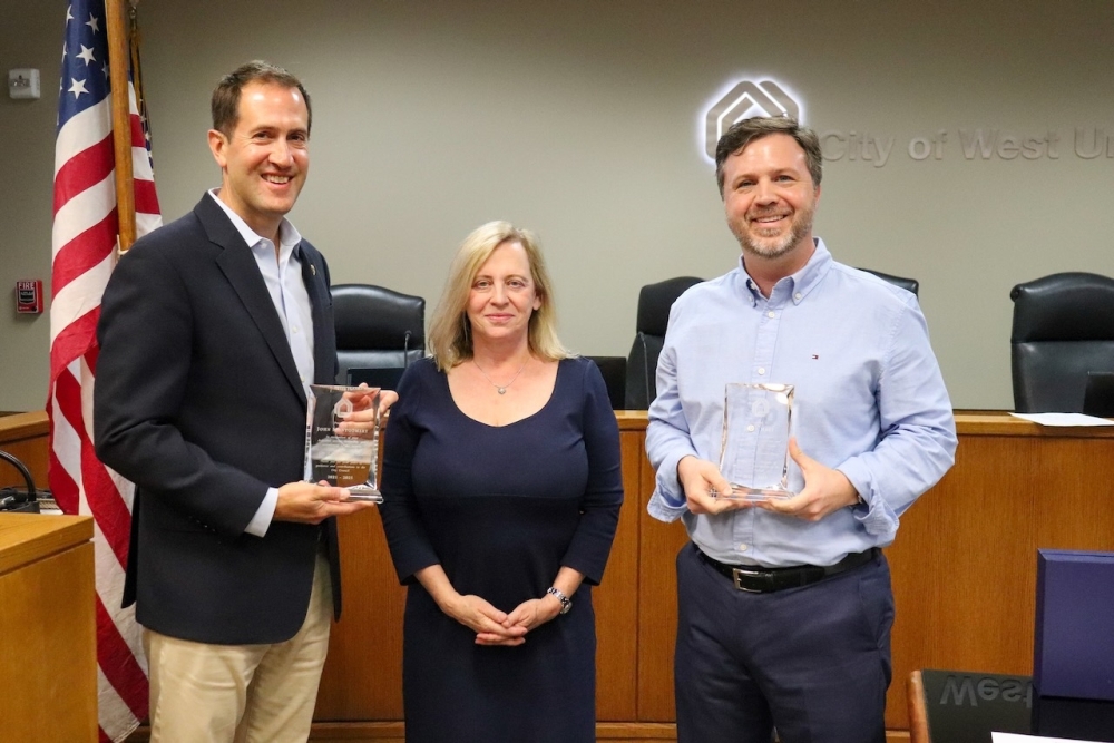 The former Mayor Pro Tem John Montgomery, Mayor Susan Sample, and former council member Matt Hart accept awards from the city at a May 19 City Council meeting. (Courtesy West University Place)