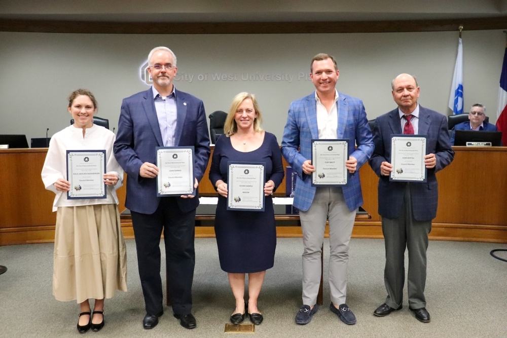 The newly-elected West University Place City Council and Mayor Susan Sample accept their election certificates at a May 19 City Council meeting. (Courtesy West University Place)