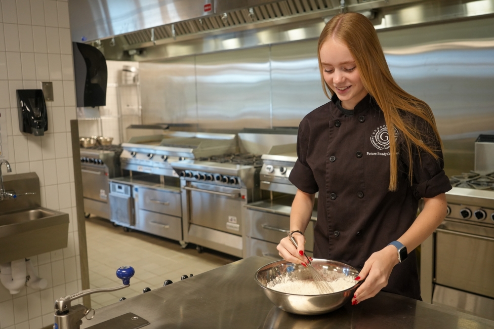 Student in high school culinary program