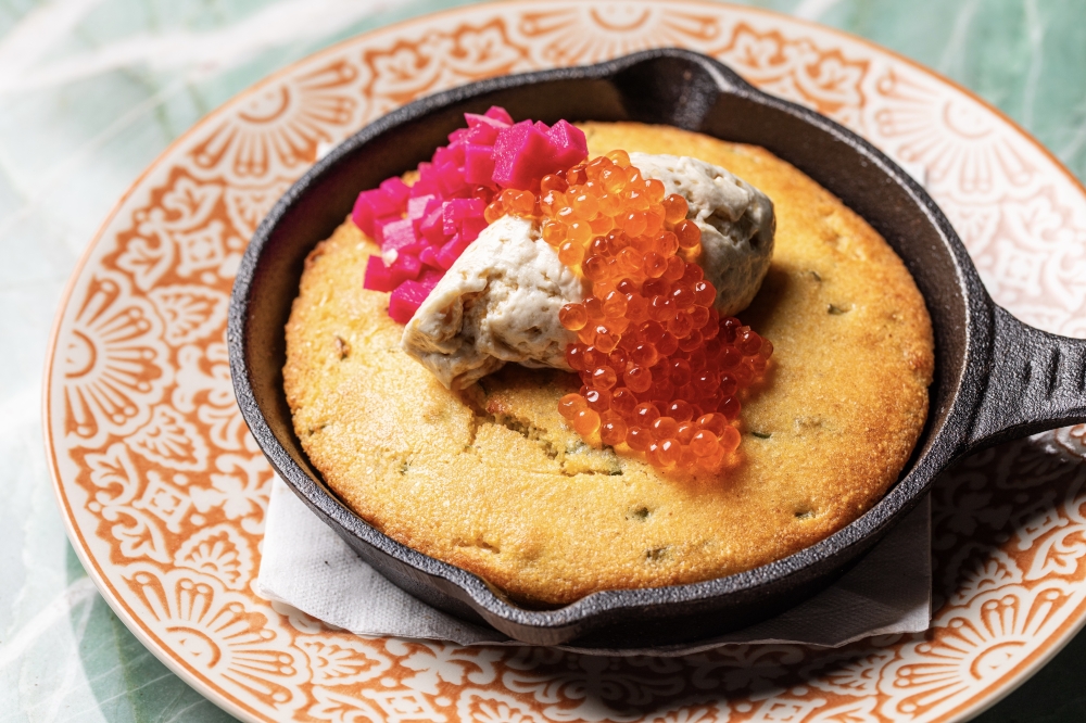 A cast iron cornbread made with Steen's Cultured Butter, radish, pickled turnip and smoked trout roe. (Courtesy Becca Wright)