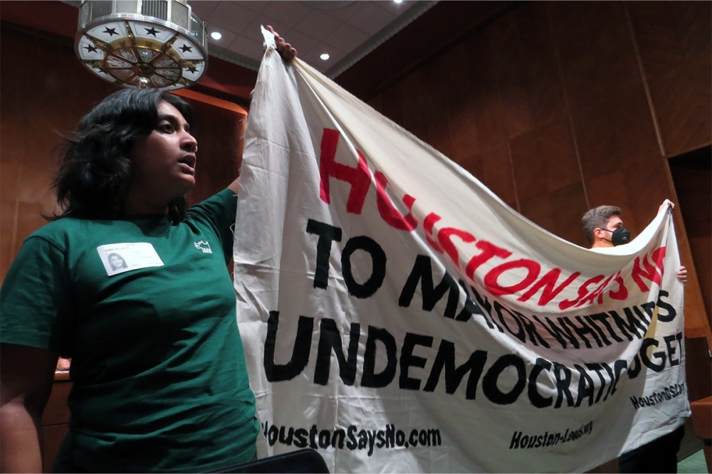 Protesters from West Street Recovery, Northeast Action Collective and Pure Justice protested during the June 4 City Council meeting spoke against the $7 billion budget. (Kevin Vu/Community Impact)