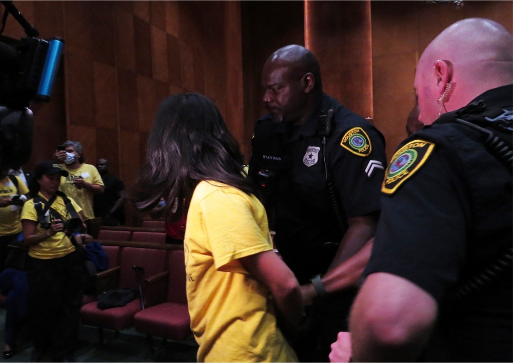 More than 40 protesters were removed from City Hall, disrupting the meeting. (Kevin Vu/Community Impact)