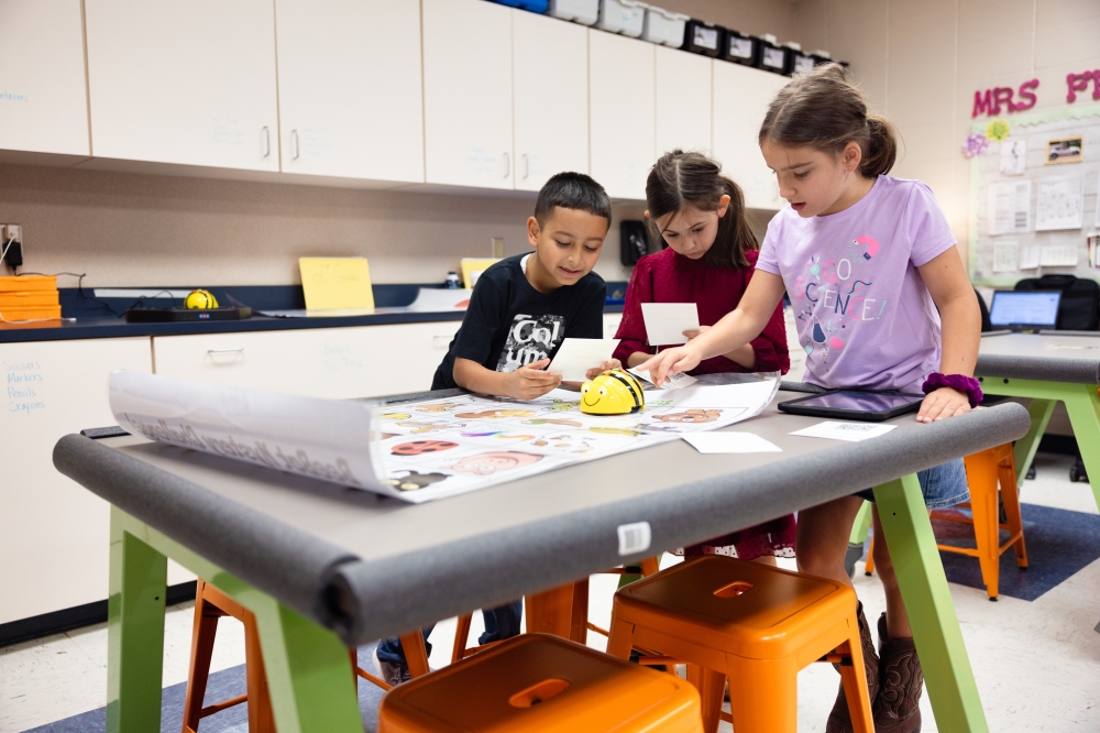 Children talking at Houston school with open enrollment