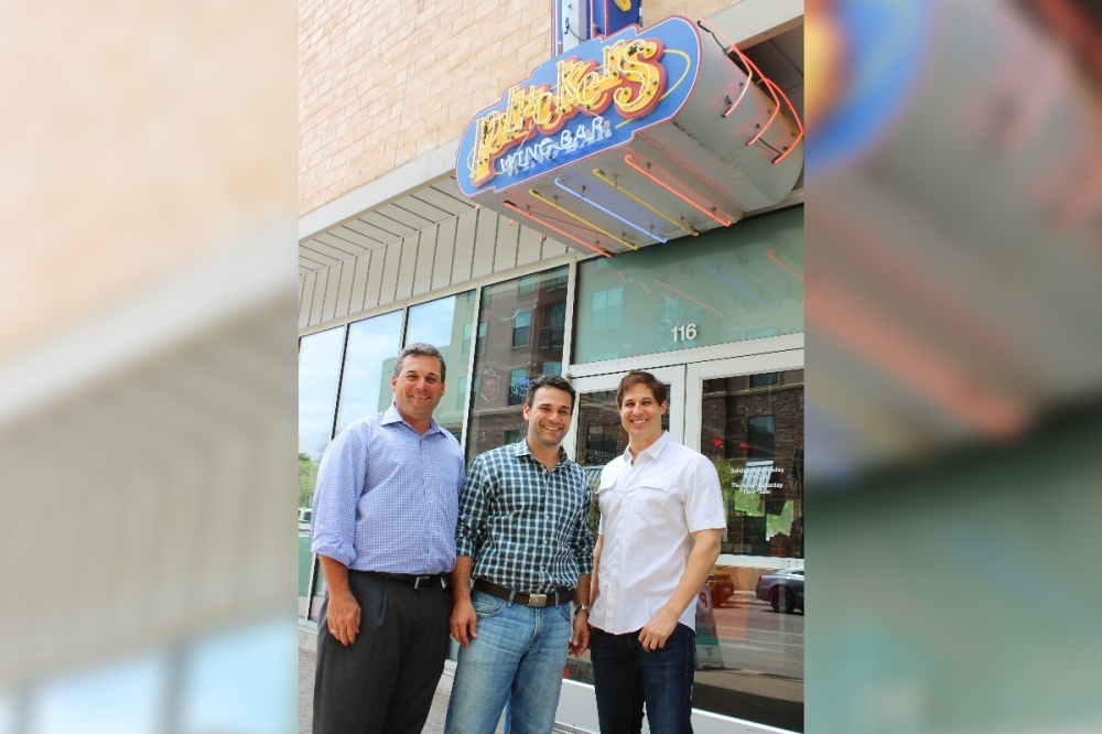 Pluckers Wing Bar co-owners Mark Greenberg, Sean Greenberg and Dave Paul. (Courtesy Pluckers Wing Bar)