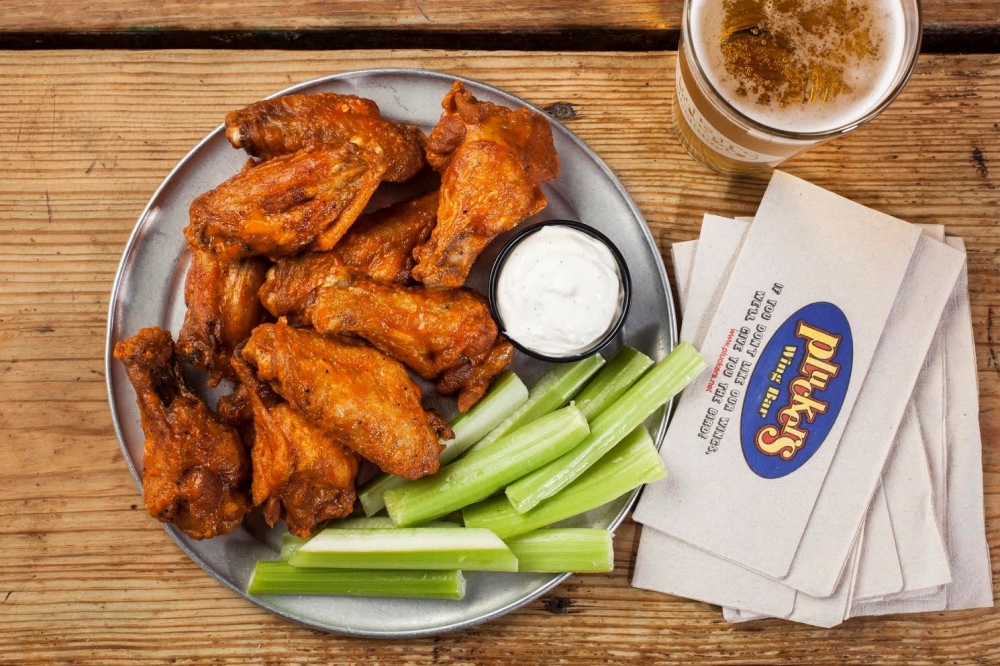 Pluckers Wing Bar serves chicken wings with a variety of sauce options. (Photo by Melissa Skorpil, courtesy Pluckers Wing Bar)