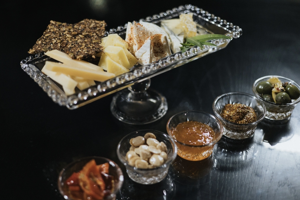 The Texas Artisan Cheese Board showcases locally sourced cheeses and honeys. (Courtesy Manoah Rodriguez)