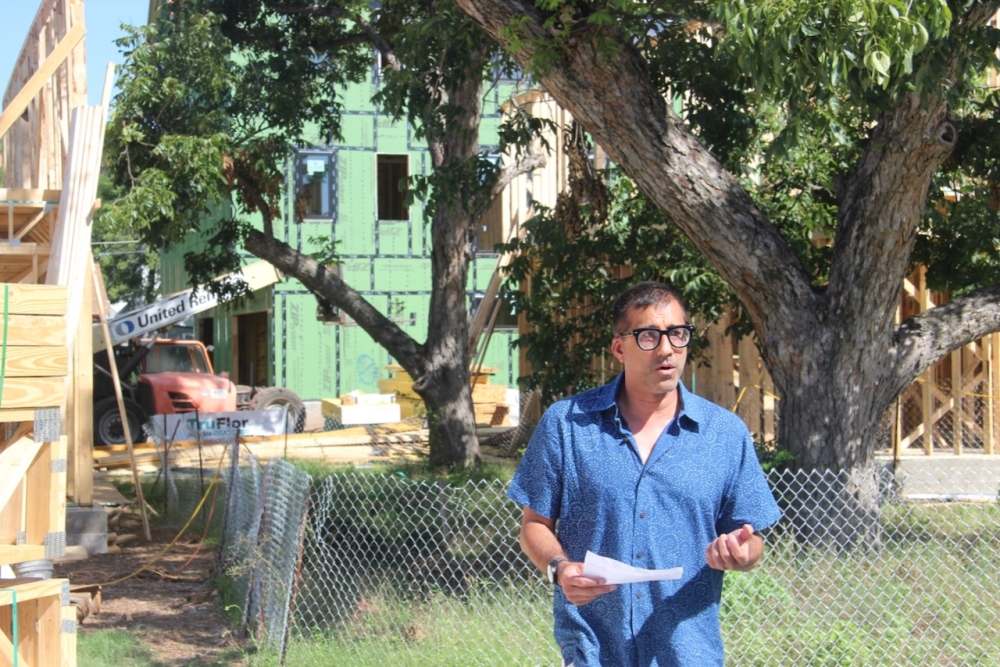 Aus/Bos Social Housing President Anmol Mehra spoke about the Mira project at its June groundbreaking. (Ben Thompson/Community Impact)