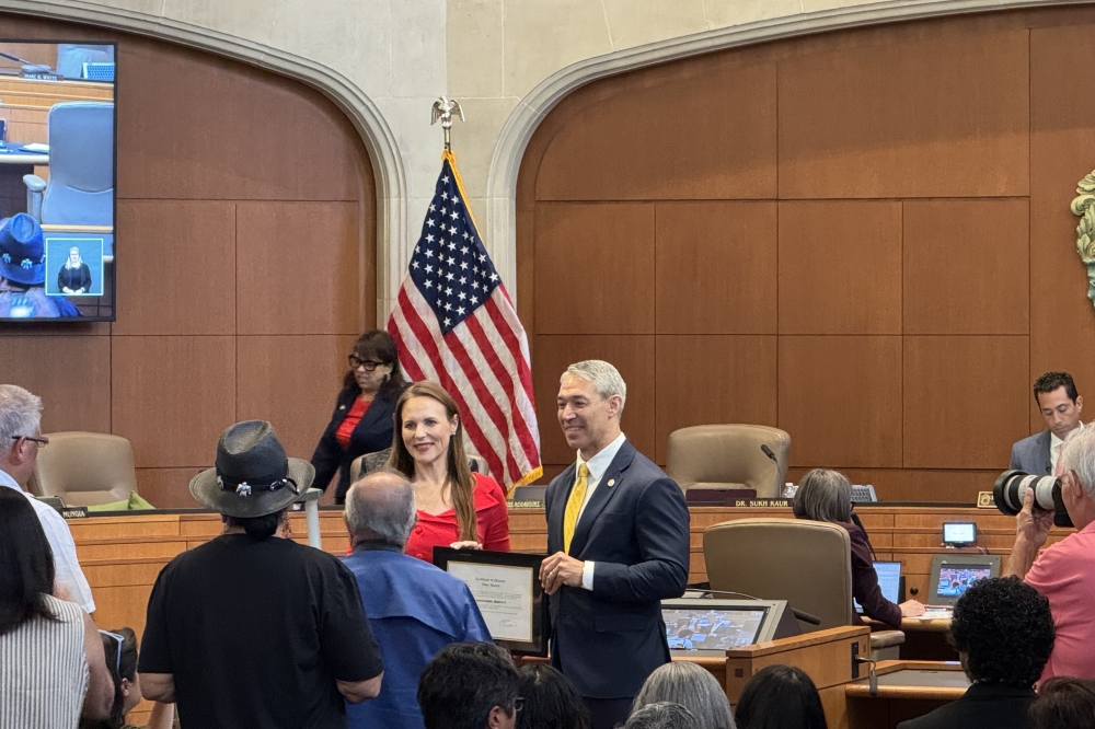 Former Mayor Ron Nirenberg presenting the certificate of election to District 9 council member Misty Spears. (Parks Kugle/Community Impact)