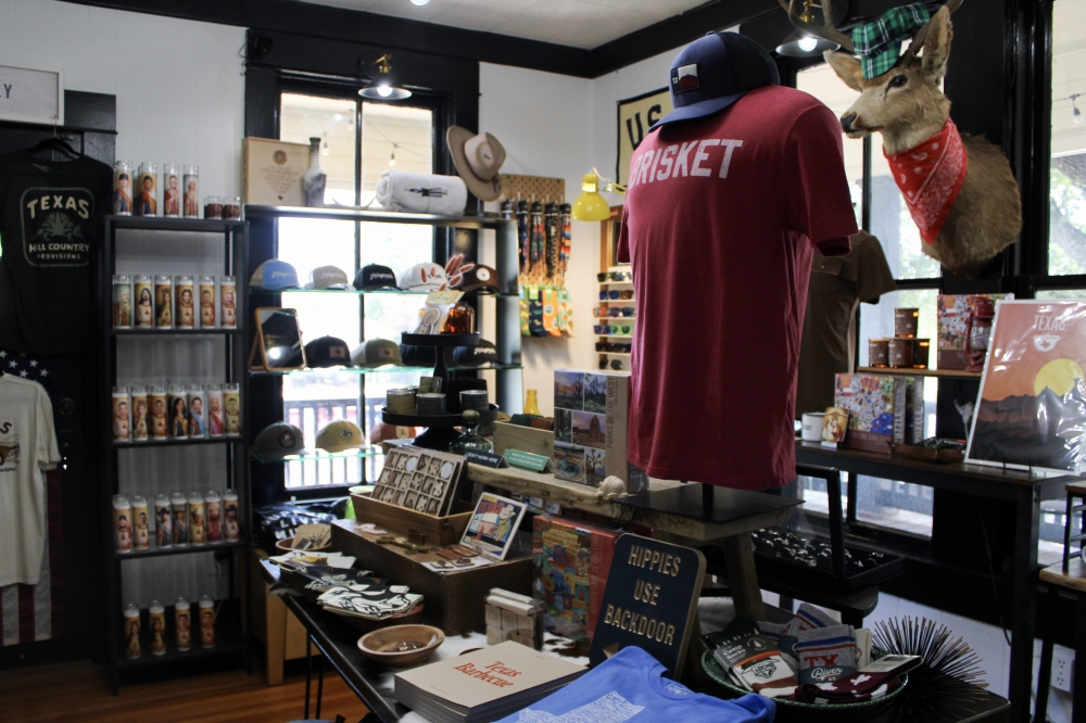 Derrick Davis recently launched a men's section in the store which features shirts, hats, koozies, bracelets and more. (Dacia Garcia/Community Impact)