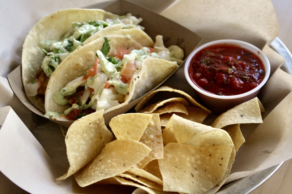 The menu also features popular tex-mex dishes like the blackened tilapia tacos served with chips and salsa. (Katlynn Fox Community Impact)