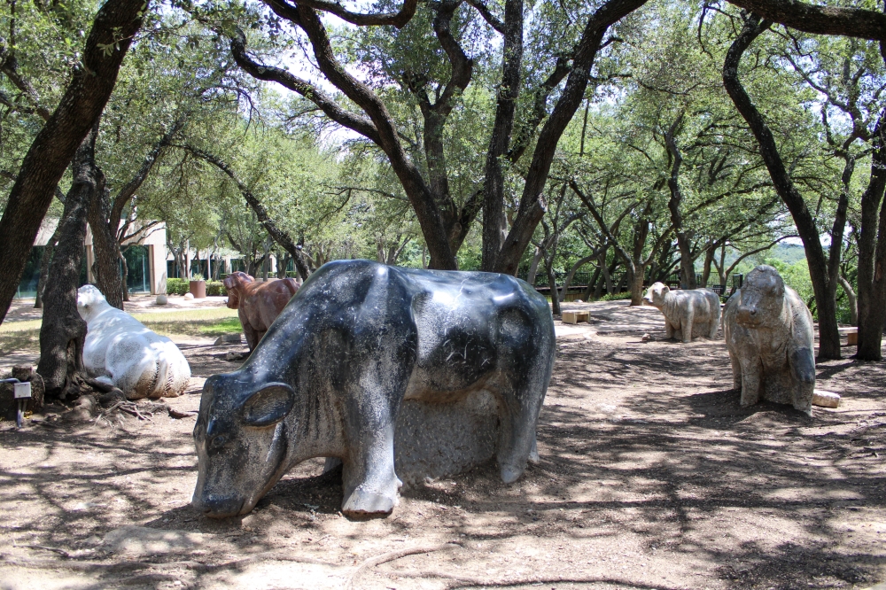 The shopping center has various statues including a cow statue created by Harold F. Clayton. (Dacia Garcia/Community Impact)