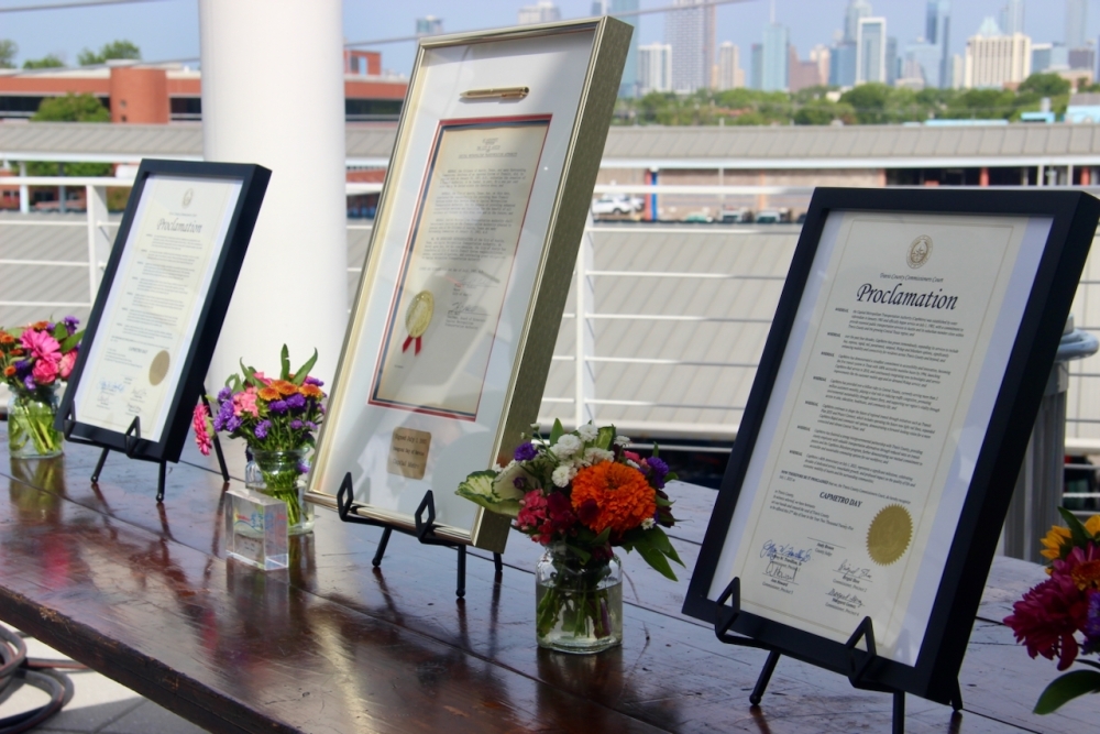 CapMetro Day proclamations from Travis County leaders were displayed alongside the initial document authorizing the transit agency's 1985 service launch. (Ben Thompson/Community Impact)