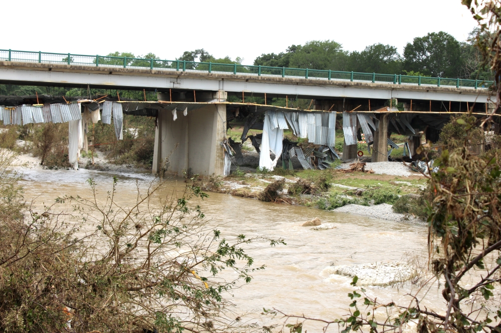 The bottom of the Austin Avenue bridge in Georgetown near Second Street received significant damage from the flooding events July 5. The bridge is just east of Blue Hole Park. (Anna Maness/Community Impact)