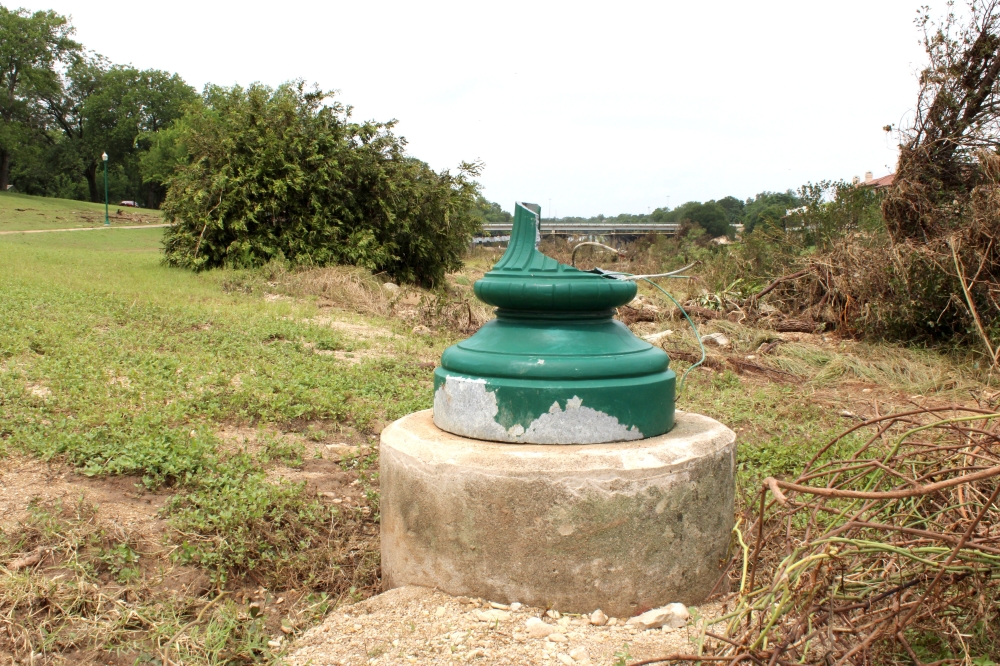 At least two lamp posts along the South San Gabriel River Trail in Georgetown were destroyed by the flood. (Anna Maness/Community Impact)
