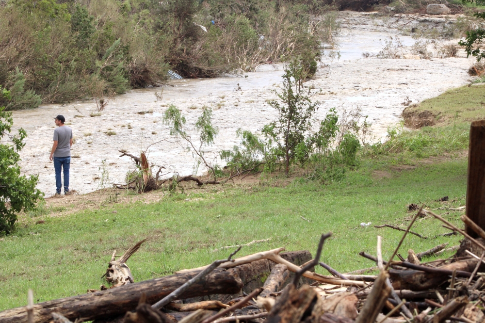 Skylar Smith returned to the South Fork San Gabriel River in Georgetown July 7 to survey the damage in the area. (Anna Maness/Community Impact)