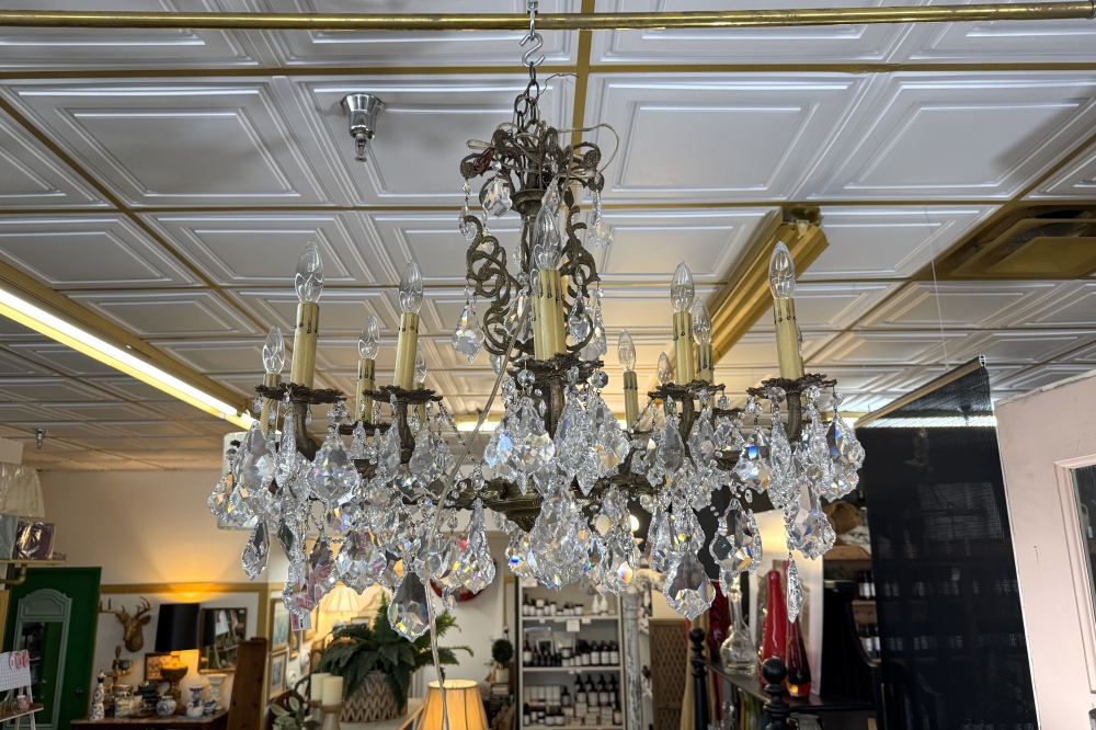 A 1920s chandelier from Georgia that Gary McNabb refurbished hangs in the home decor store next to Austin Lampworks. (Anna Maness/Community Impact)