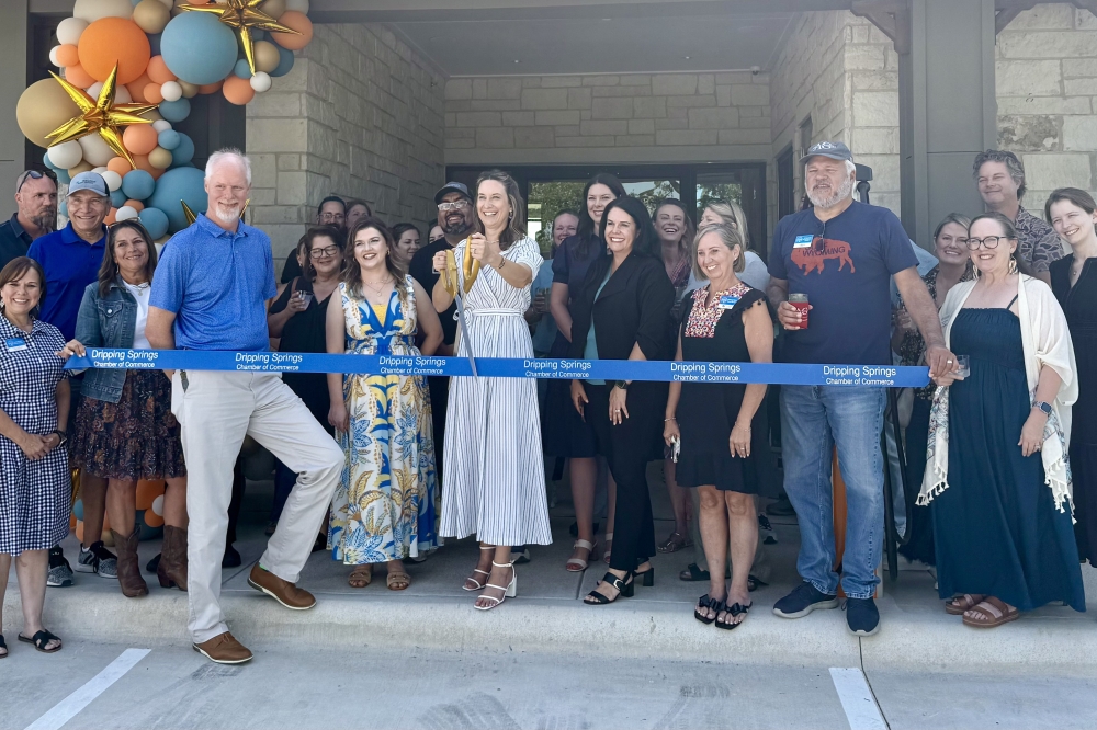 The Local Dripping Springs apartments staff celebrated the opening of the new complex with a ribbon cutting in June. (Judy LeBas/Community Impact)