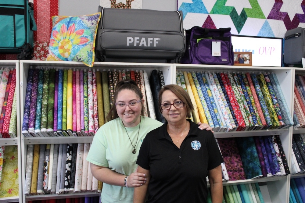 Owner Cyndi Grome (right) and her daughter Hannah Brook are apart of the multi-generational ownership of Grome's Sewing Machine Company. (Andrew Creelman/Community Impact)