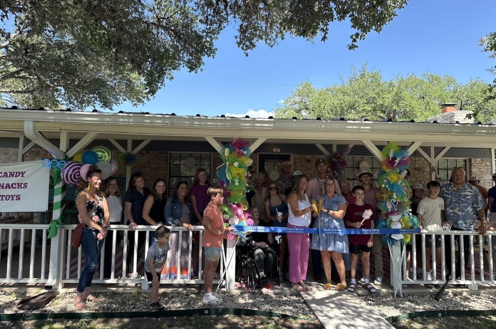 Southern Sweets Candy Company owners, Paige Powell (center, left) and Marianne Gibson (center, right), held a ribbon cutting with the Dripping Springs Chamber of Commerce on July 23 to celebrate the business' recent opening. (Judy LeBas/Community Impact)