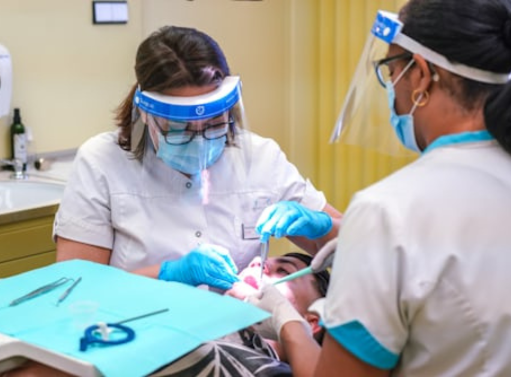 Dentists working with patient for dental care