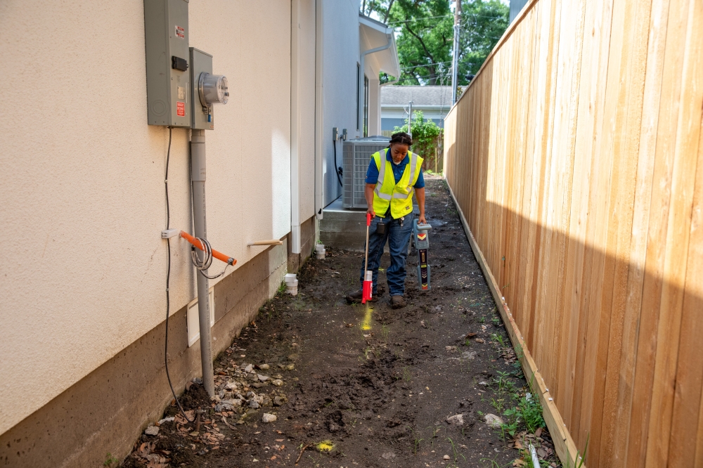 Person spraying where underground gas lines are