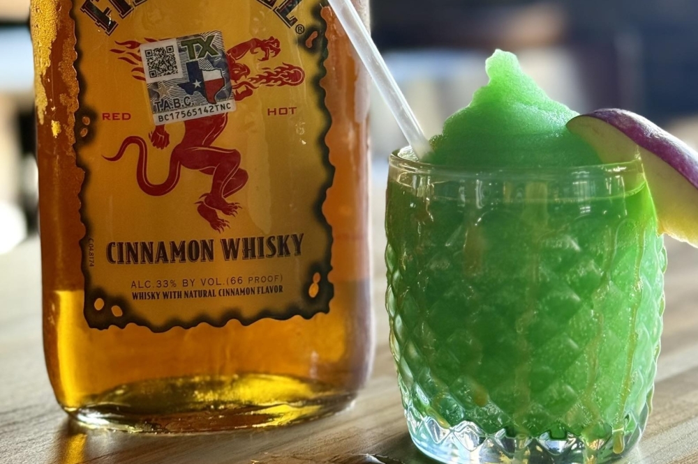 The new Frozen Poisoned Apple cocktail is a mix of Fireball, green apple pucker and lemonade. (Courtesy Katy Crossing Icehouse via Facebook)