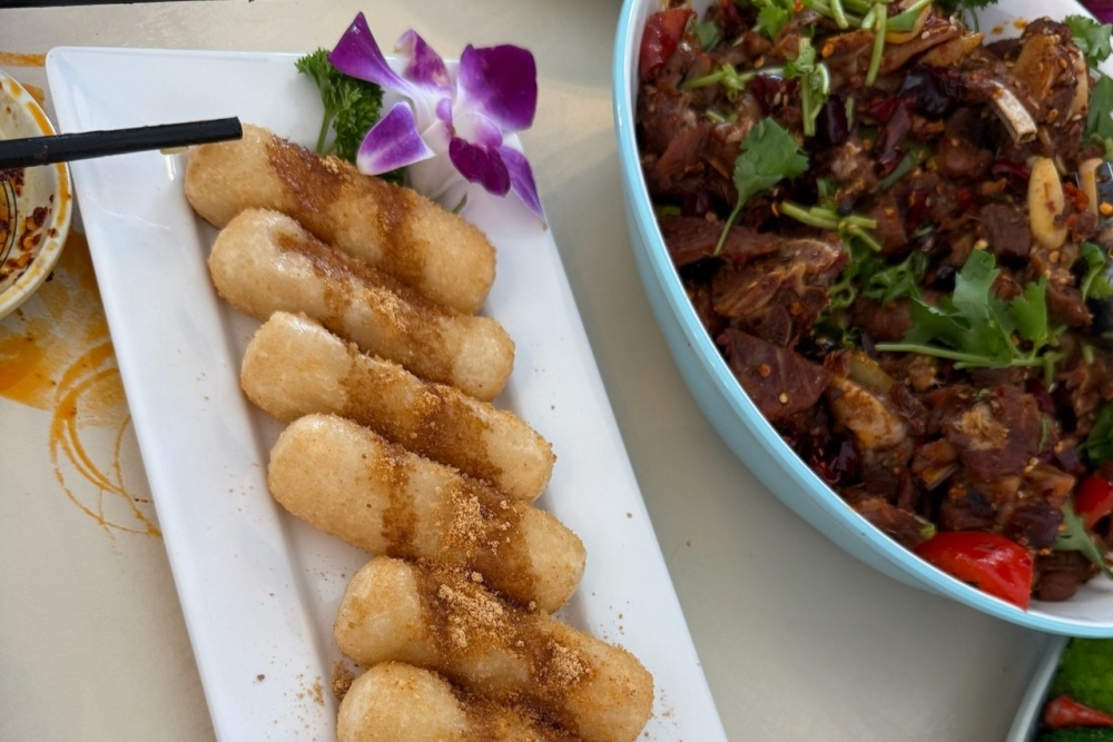 Guests can choose from a variety of traditional Chinese dishes on the menu including hand-folded dumplings, Sichuan noodles made in-house, crispy stir-fried chicken or beef, and fried rice. (Courtesy Ni Hao Chinese Cuisine)