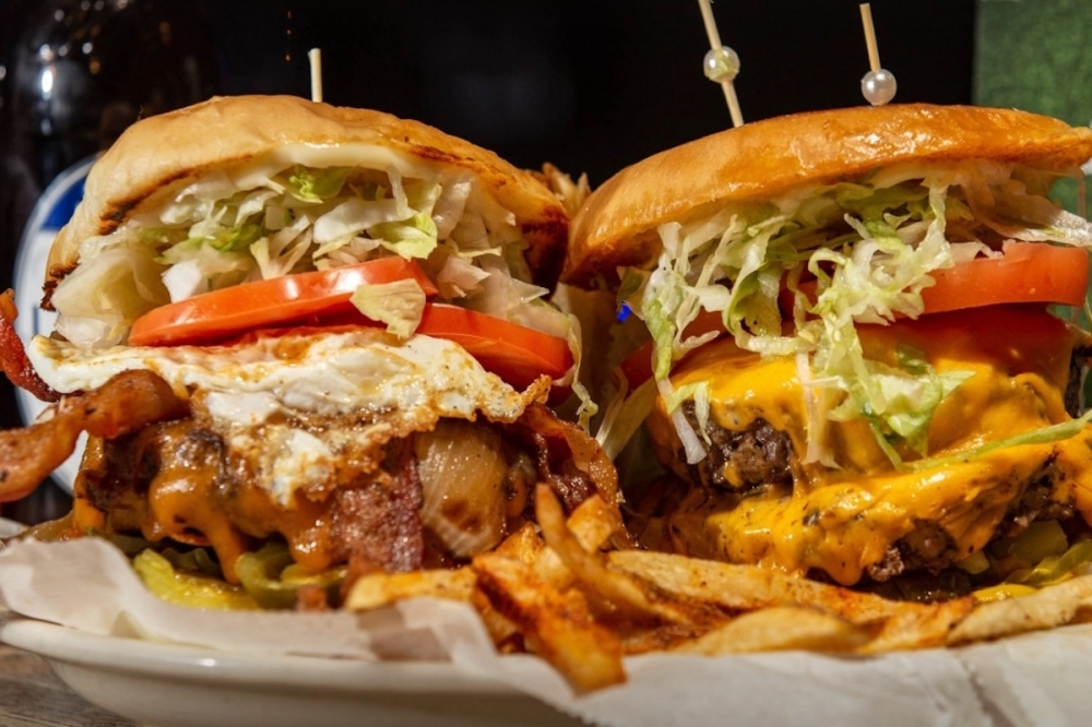Iron Horse offers a plethora of speciality burgers, ranging from The Bossman ($13.99) to a classic Double Double ($15.99). (Courtesy Iron Horse Bar & Grill)