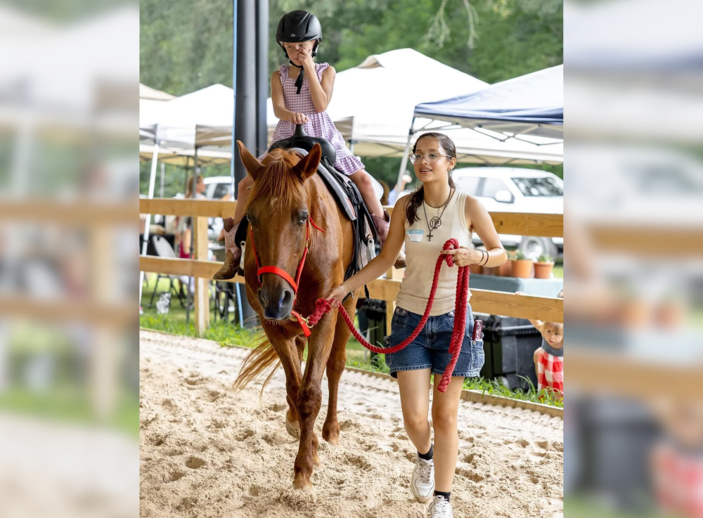 Child riding a horse