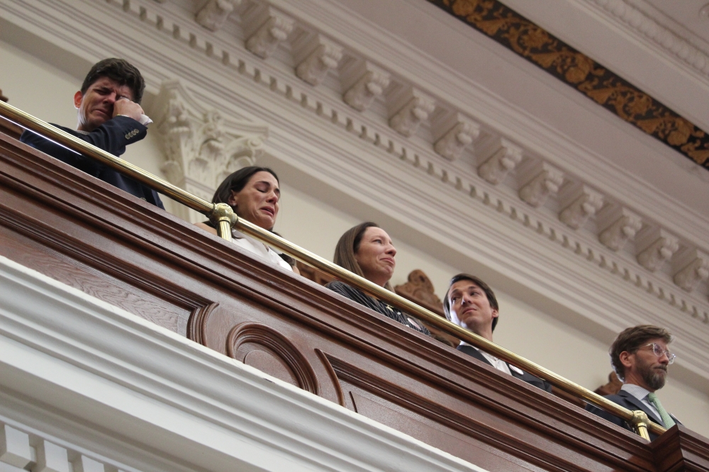 Family members of the victims' of flooding at Camp Mystic shed tears as Texas House lawmakers prepared to vote on legislation to increase flood safety at youth camps in the House chamber Aug. 21. (Chloe Young/Community Impact)