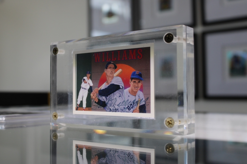 Primetime Sports Cardz offers a wide variety of sports cards across all major leagues, such as this vintage, signed Ted Williams card. (Andrew Creelman/Community Impact)