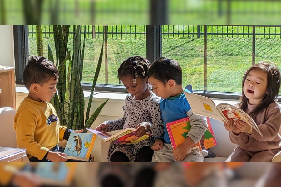 Children reading books in a classroom