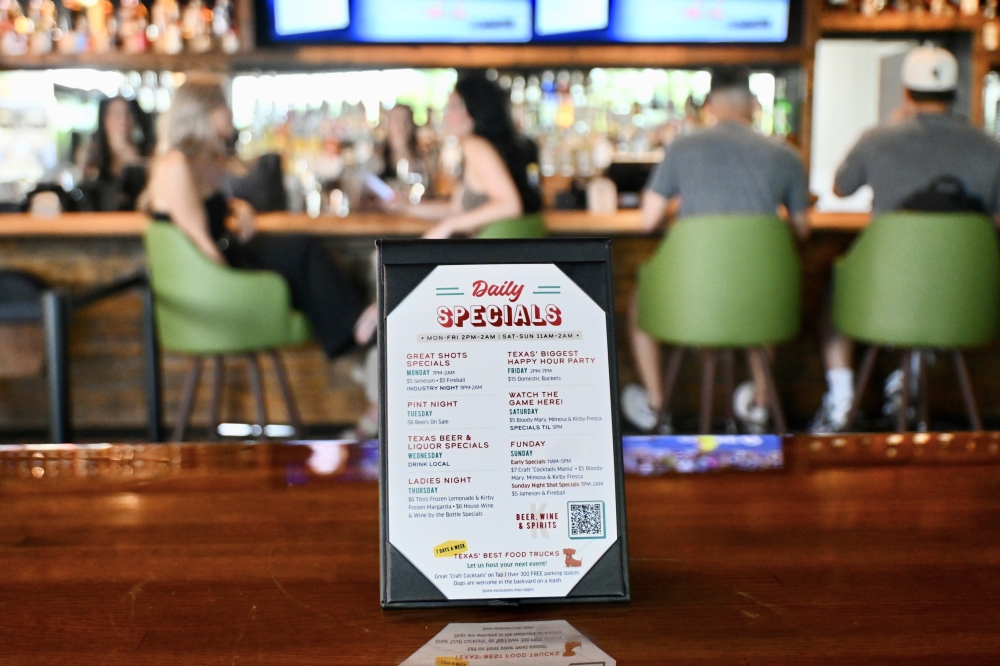 A list of daily specials includes pint night on Tuesdays, with 56 beers on sale, and ladies night on Thursdays with $6 house wine specials. (Community Impact/Roo Moody)