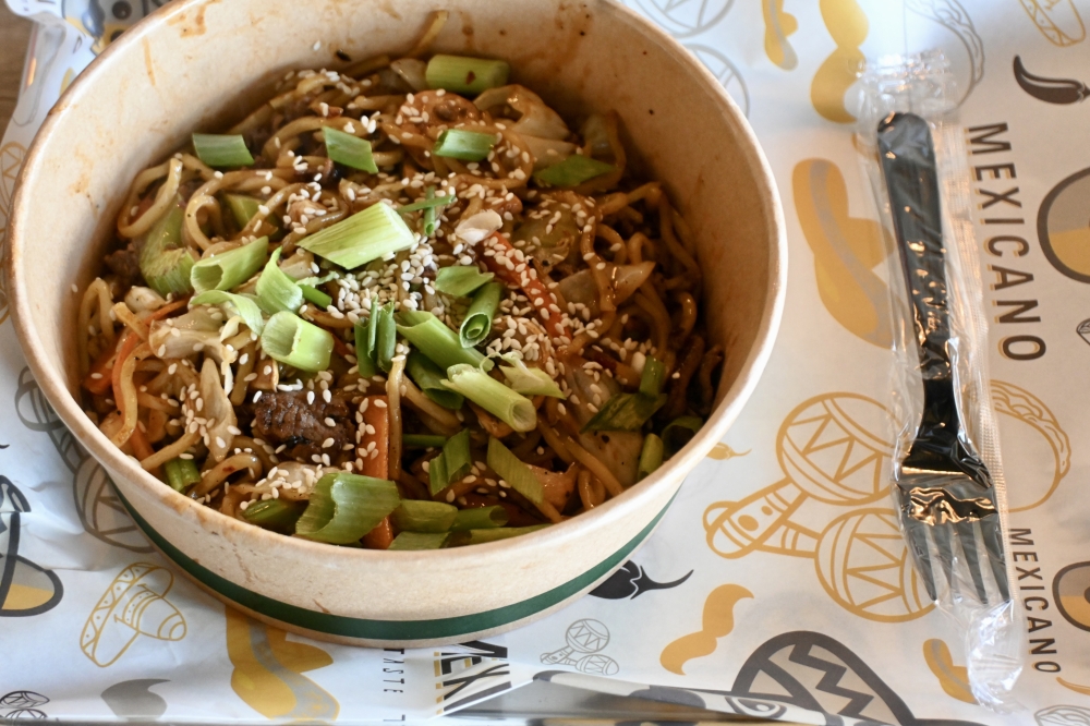 A bowl of Mexicano's Asian noodles costs $15 and is mixed with cabbage, carrots, celery, bean sprouts, green onions and mushrooms. (Roo Moody/Community Impact)