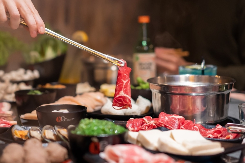 At KPOT Korean BBQ & Hot Pot, customers use grills to cook their ingredients before adding them to a pot of simmering soup stock. (Courtesy KPOT Korean BBQ & Hot Pot)
