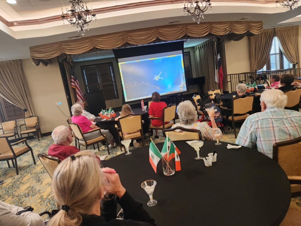 Senior living residents watching a movie