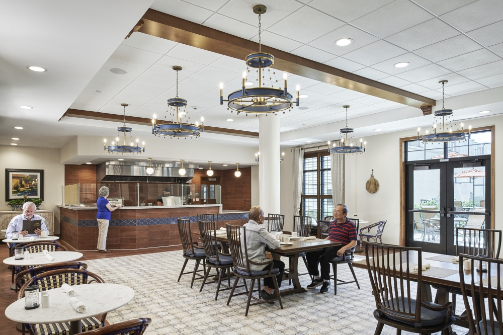 Senior living residents eat in cafeteria