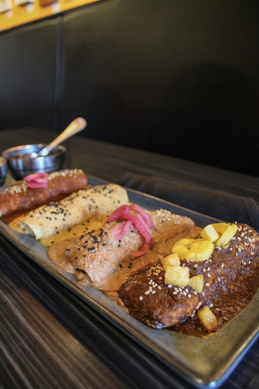 The Platon de Enchiladas de Mole gives customers a chance to taste all four mole options at the restaurant. (Dacia Garcia/Community Impact)