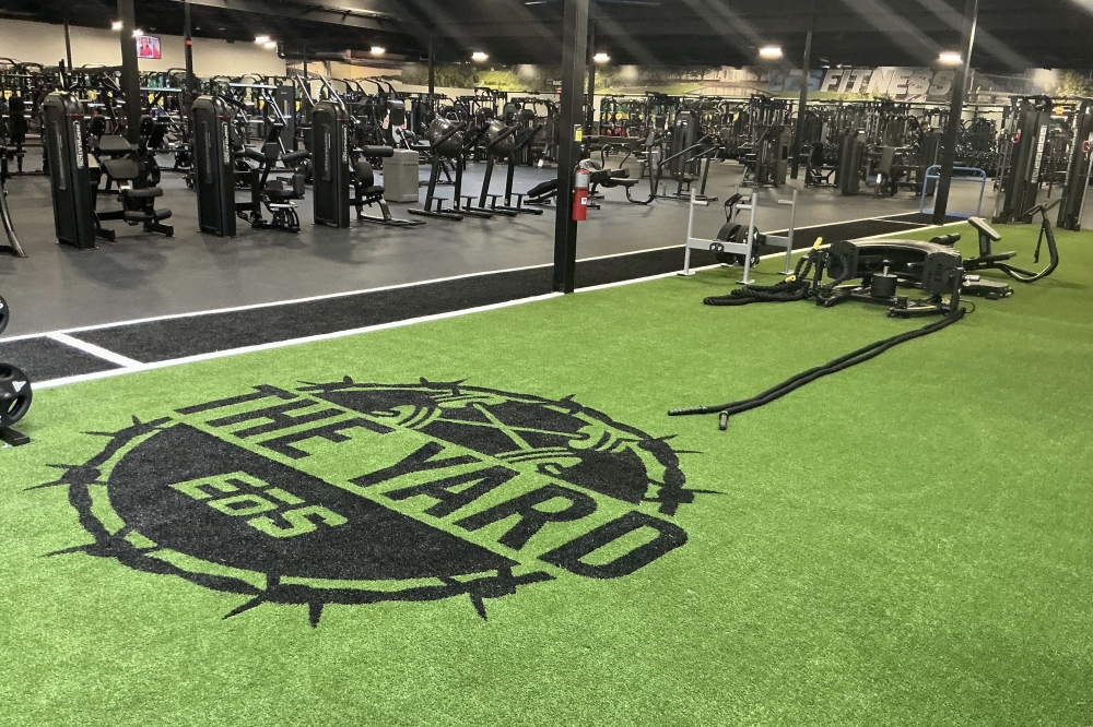 The Webster location features the EōS Yard, an indoor green turf functional training area, as well as an outdoor workout area. (Courtesy EōS Fitness)