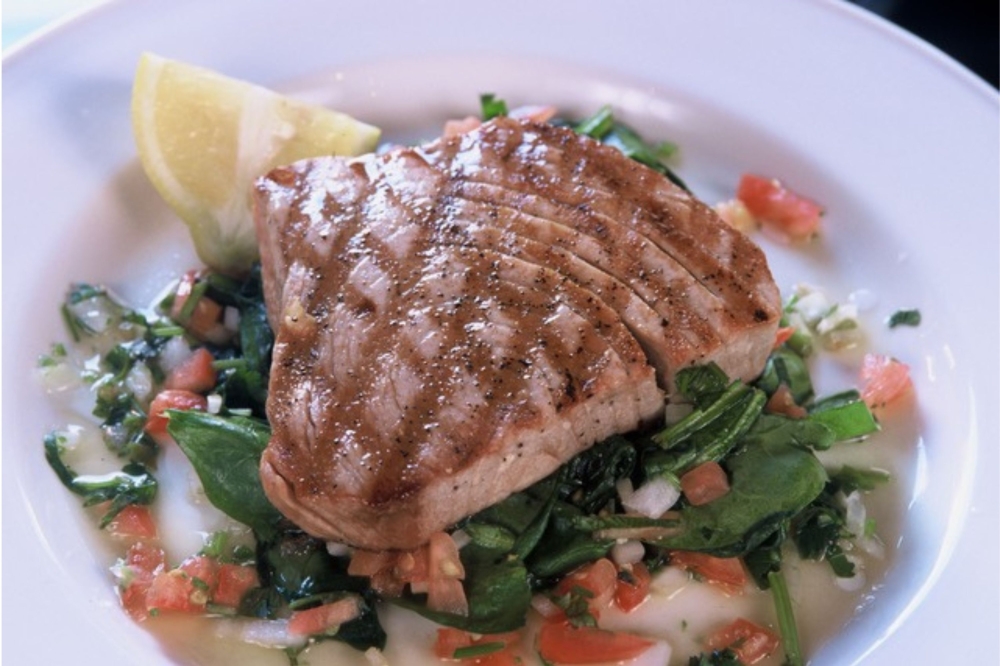Pictured is the Grilled Wild Caught Yellowfin Tuna steak on Lemon Spinach. (Courtesy Manuel's)