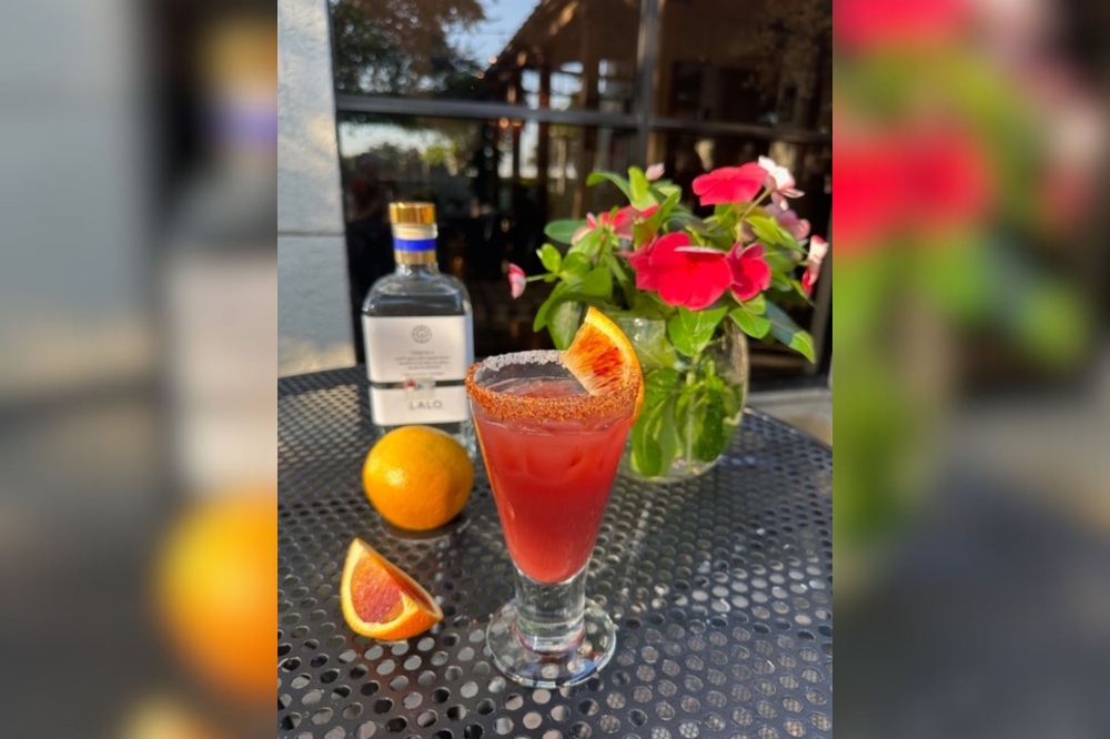 In addition to its food options, Manuel's offers specialty cocktails including the pictured Manuelian Sunset Blood Orange Margarita. (Courtesy Manuel's)