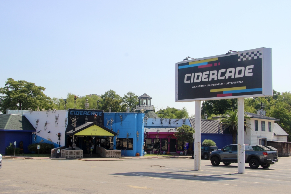 A nearly 50-story residential tower with street-level commercial space is planned next to Lady Bird Lake on the Cidercade property. (Ben Thompson/Community Impact)