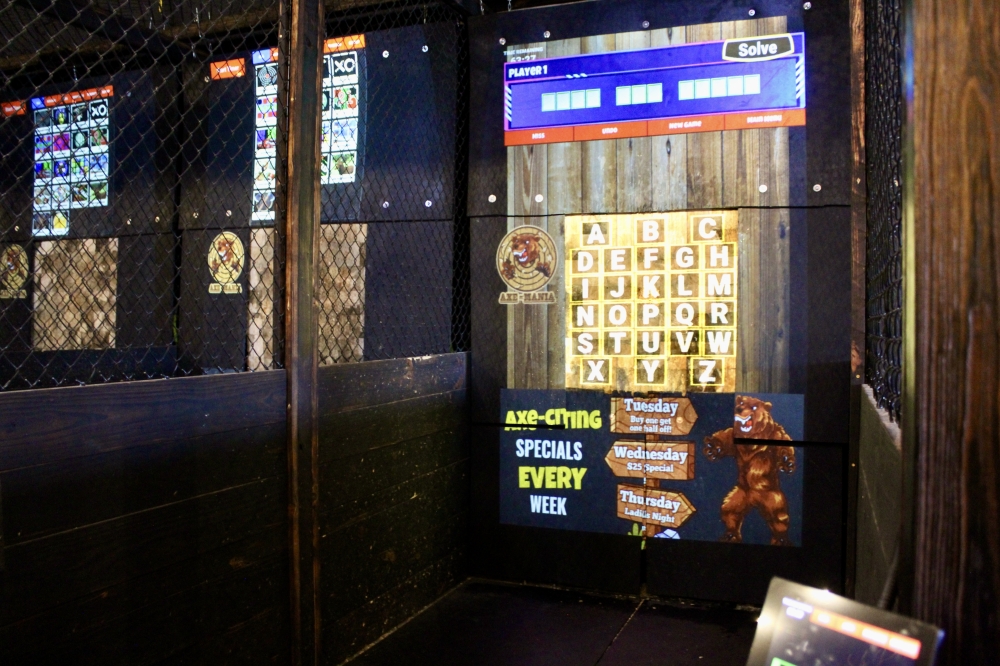 Axe Mania features projected targets with 18 games to choose from. (Jovanna Aguilar/Community Impact)